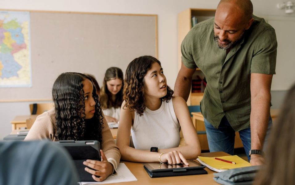 Teacher Learning doubt of 2 girls in School Classroom