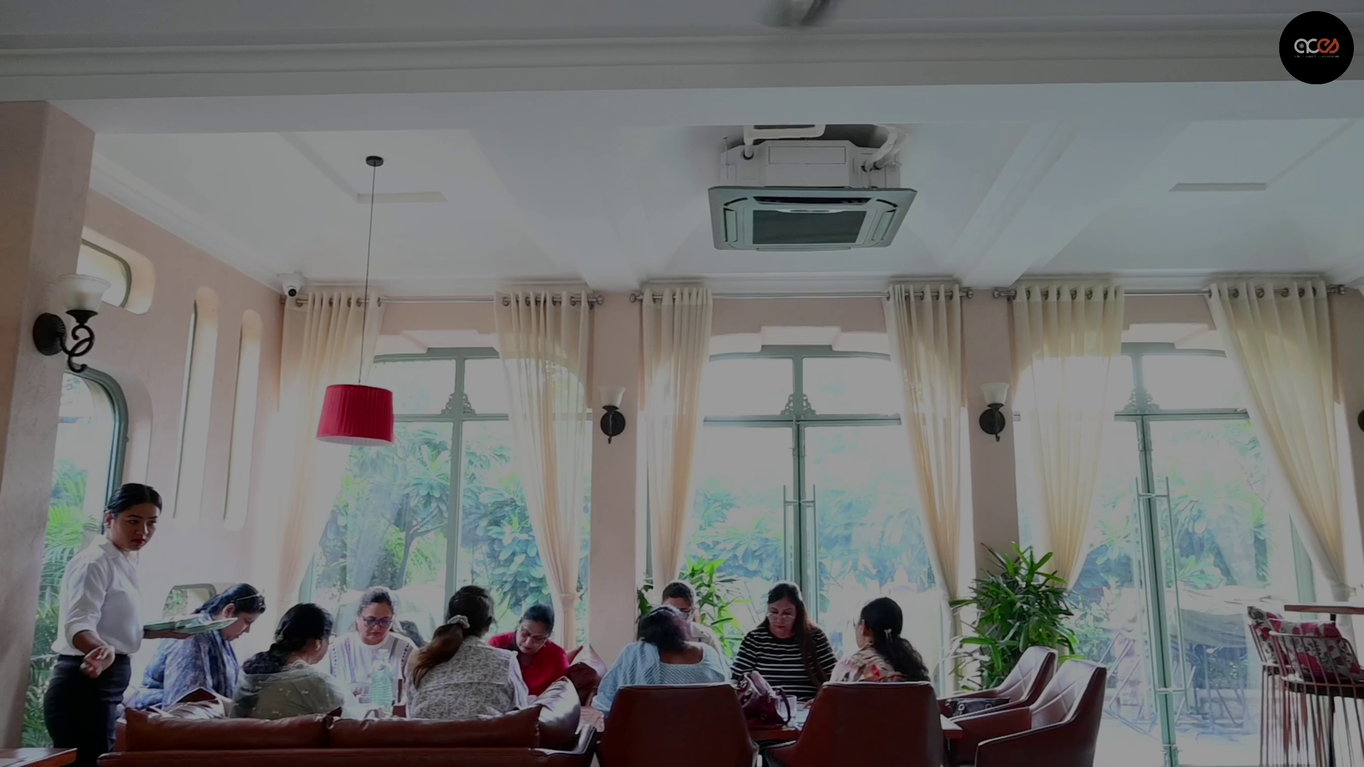 womens group enjoying their lunch in 4 Way cassette ACs cool environment